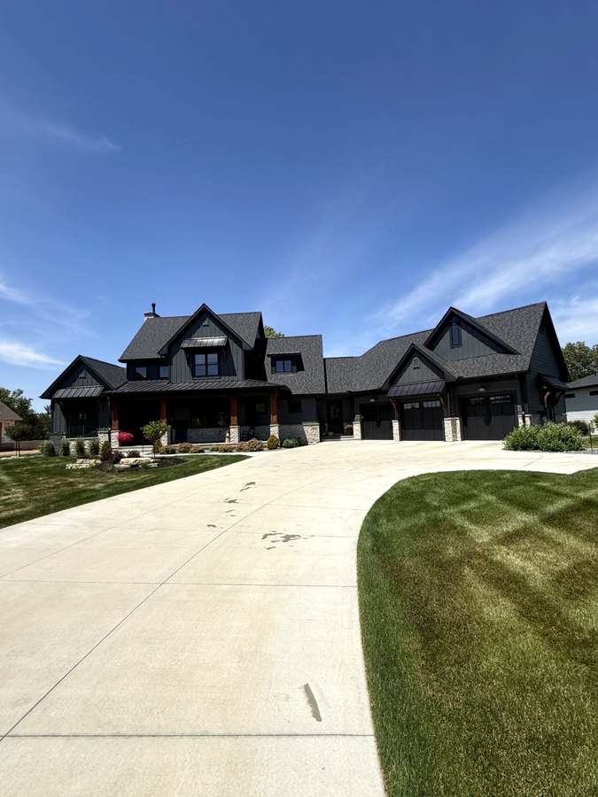 Black modern farmhouse front exterior after window cleaning