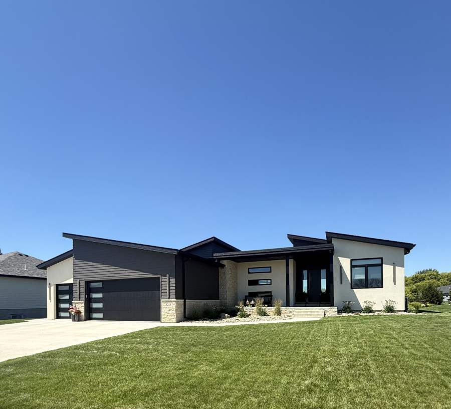 Modern dark and white two-tone home, front elevation