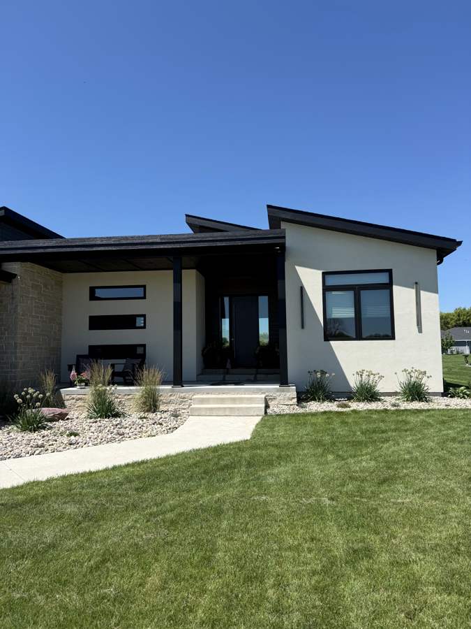 Modern dark and white two-tone home, front entry