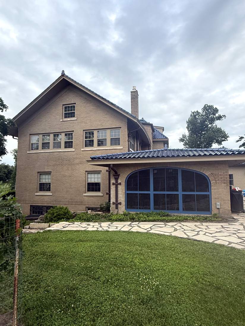 Side elevation with arched sunroom windows