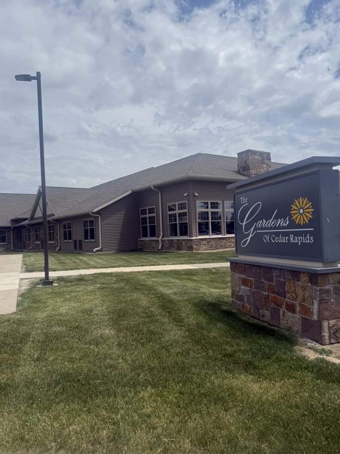 The Gardens of Cedar Rapids senior living campus and monument sign